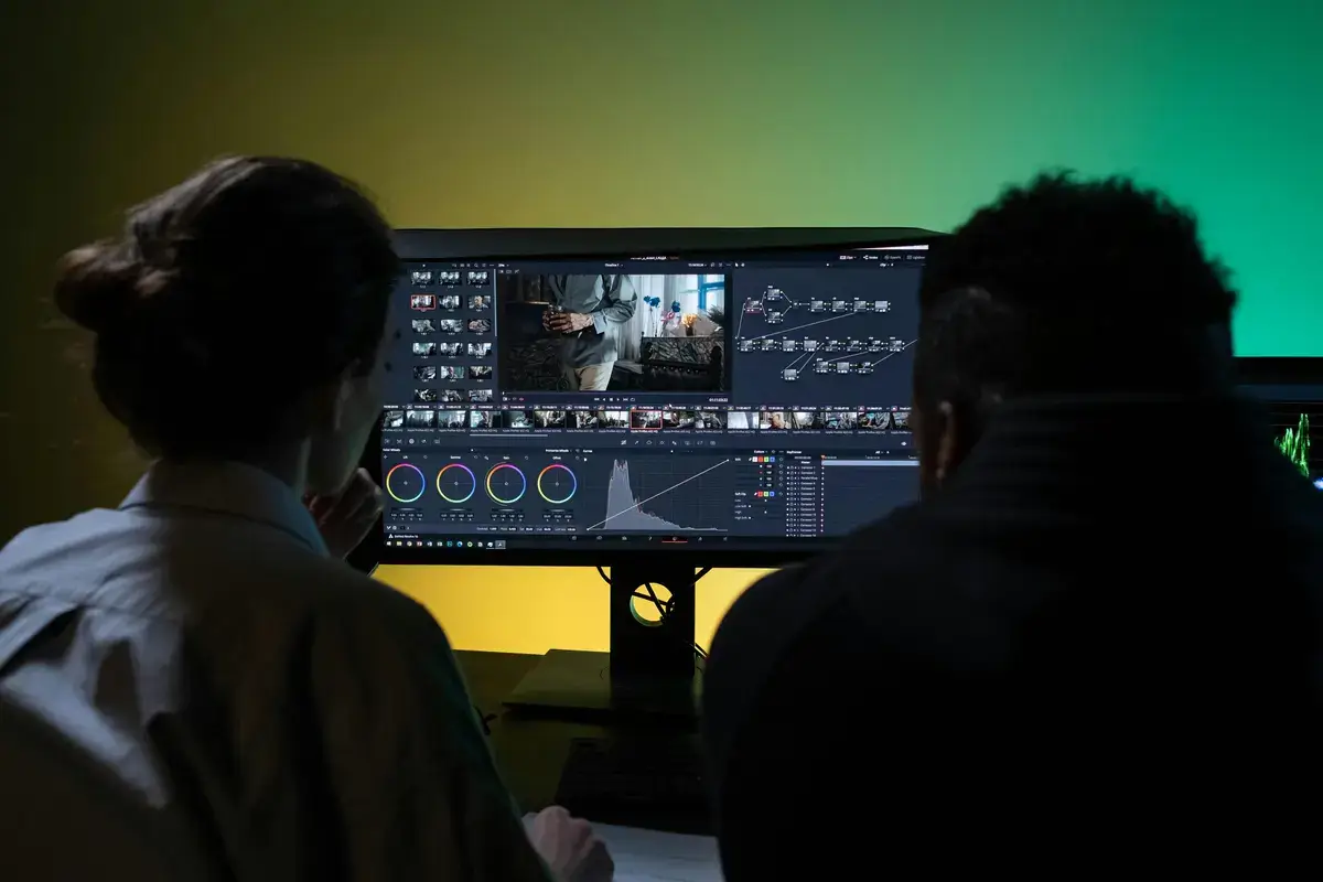 Post-production studio with editing bays, color grading monitors, and digital workflow systems
